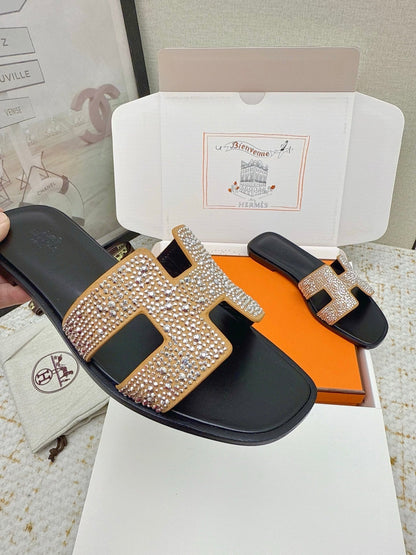 HM 26ss Oran Sandals Black Gold Crystal Cowhide 625248